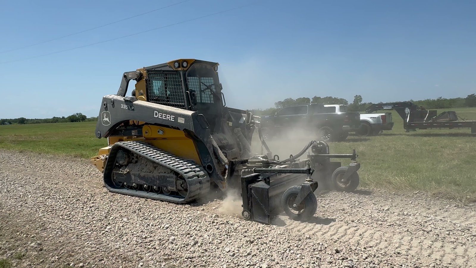 Compact track loader grading a gravel and dirt driveway surface for Your Way Land Clearing LLC