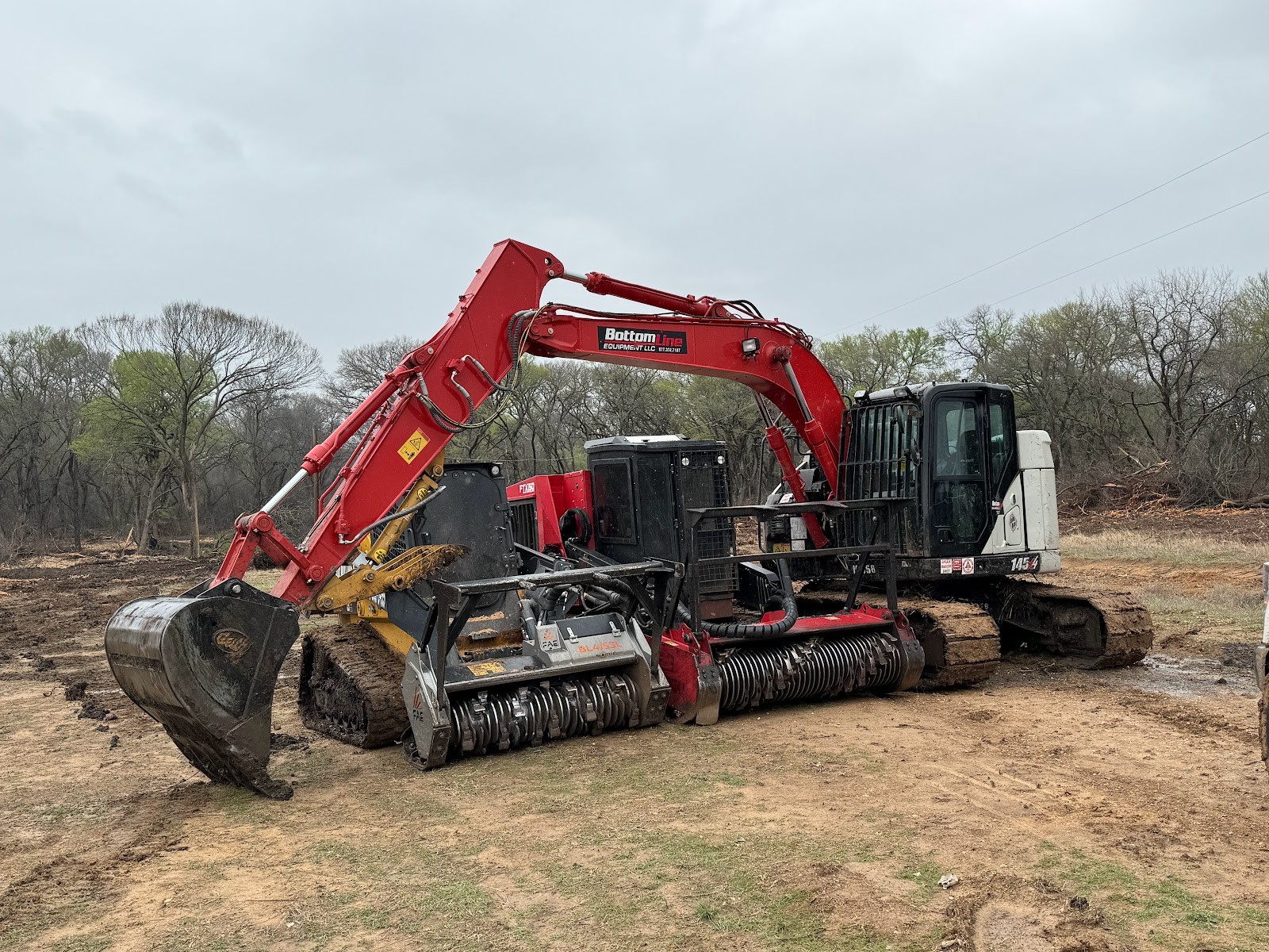 Excavator and mulching equipment on a Texas land clearing worksite