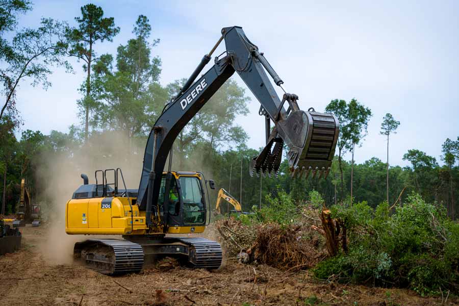 Texas land clearing equipment removing trees and brush near Cedar Creek Lake